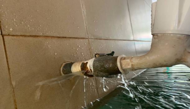 Plumber fixing sink